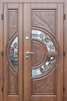 Уличная дверь в цвете Итальянский орех с виноритом и ковкой со стеклом ДВТ-147 в Мурманске